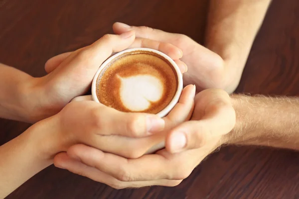 Hands holding cup — Stock Photo, Image