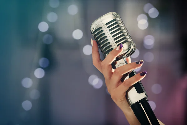 Hand with vintage  microphone — Stock Photo, Image