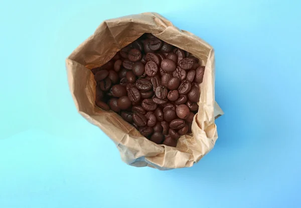 Coffee beans in paper bag — Stock Photo, Image