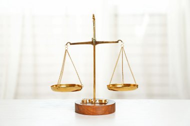 Law scales on a table clipart
