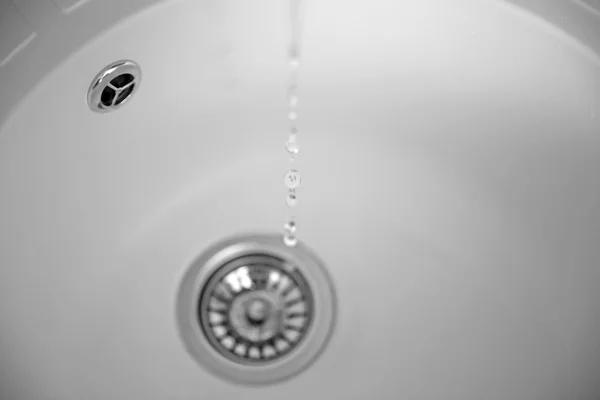 Water flowing into drain — Stock Photo, Image