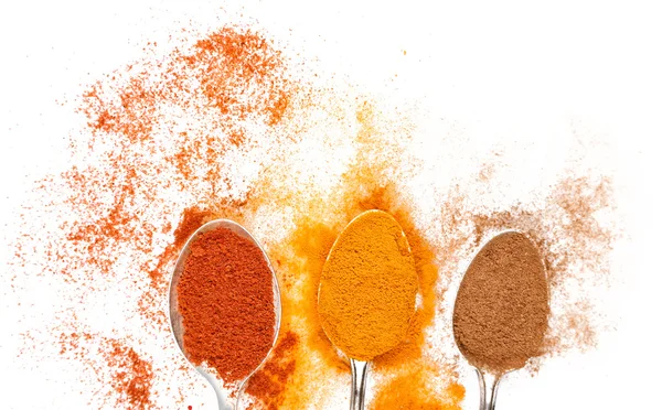 Different spices in spoons — Stock Photo, Image