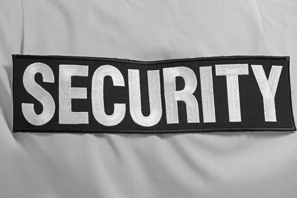 Λέξη Ασφαλείας Στο Ανδρικό Πουκάμισο Κοντινό Πλάνο — Φωτογραφία Αρχείου