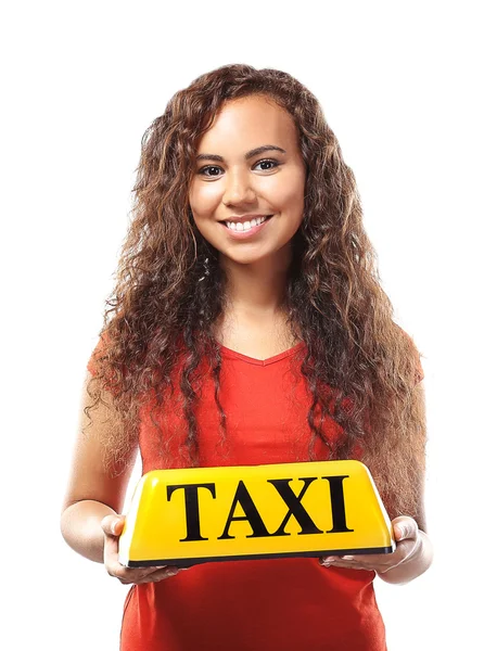 Девушка держит свет на крыше такси — стоковое фото