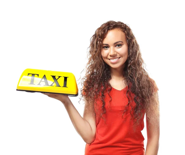 Дівчина тримає світло на даху таксі — стокове фото