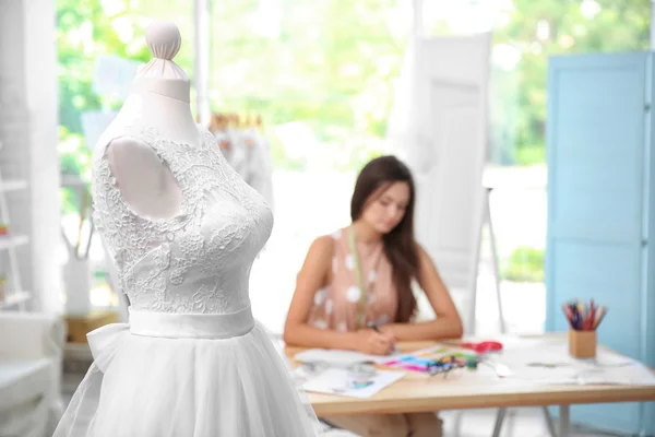 Made-up wedding dress on mannequin