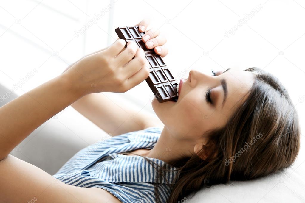 girl eating chocolate 