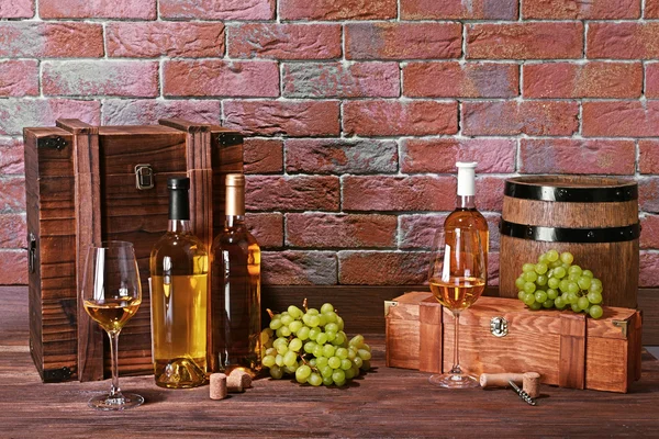 Composition of white wine on brick wall background — Stock Photo, Image