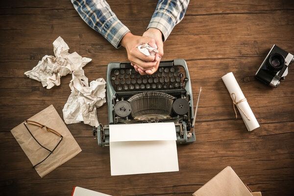 Retro reporter working at the table, top view