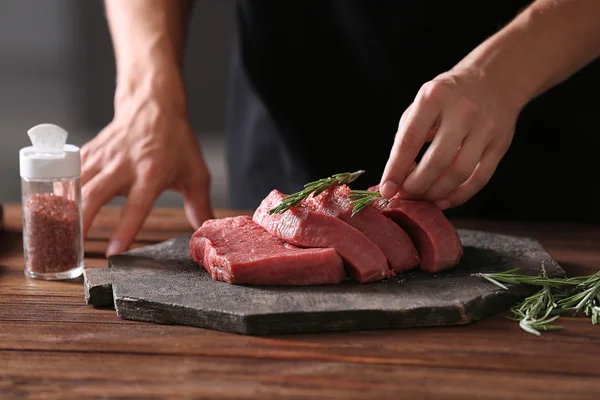 Butcher cooking pork meat — Stock Photo, Image