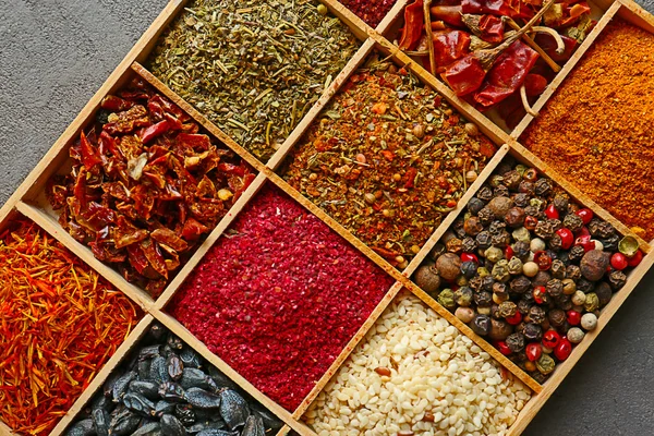 Different spices in wooden cells, closeup — Stock Photo, Image