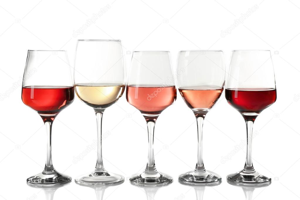 Glasses with different wine in a row, isolated on white