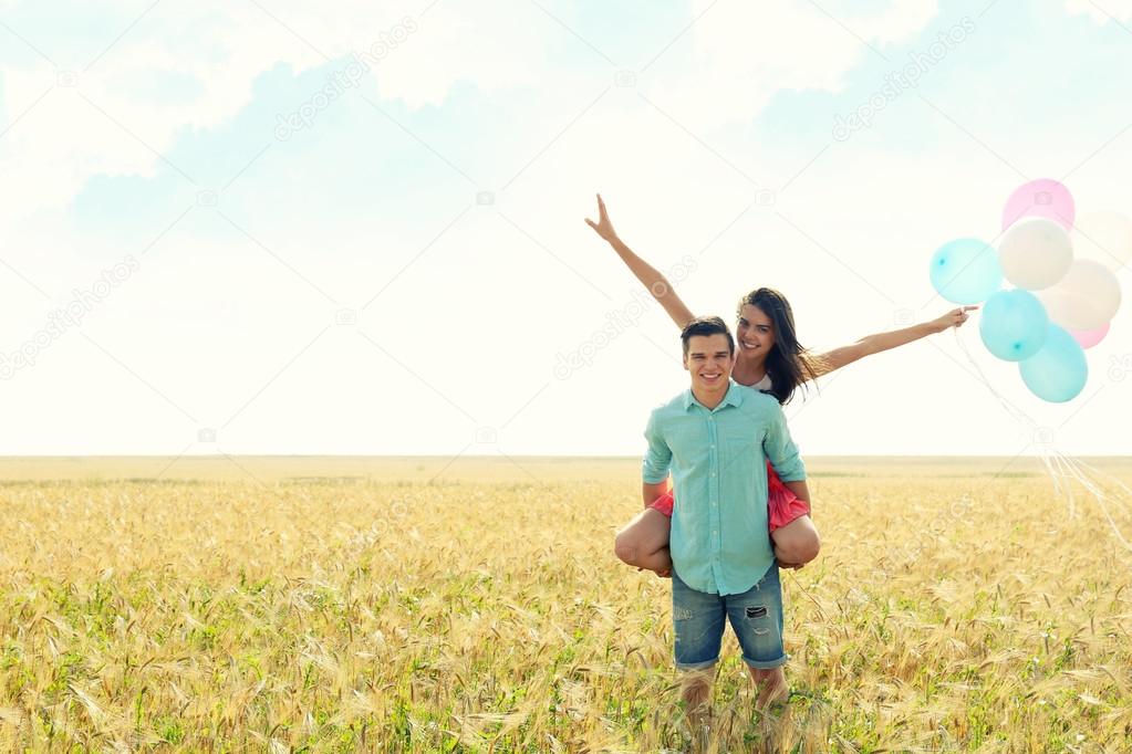 couple with toy air balloons