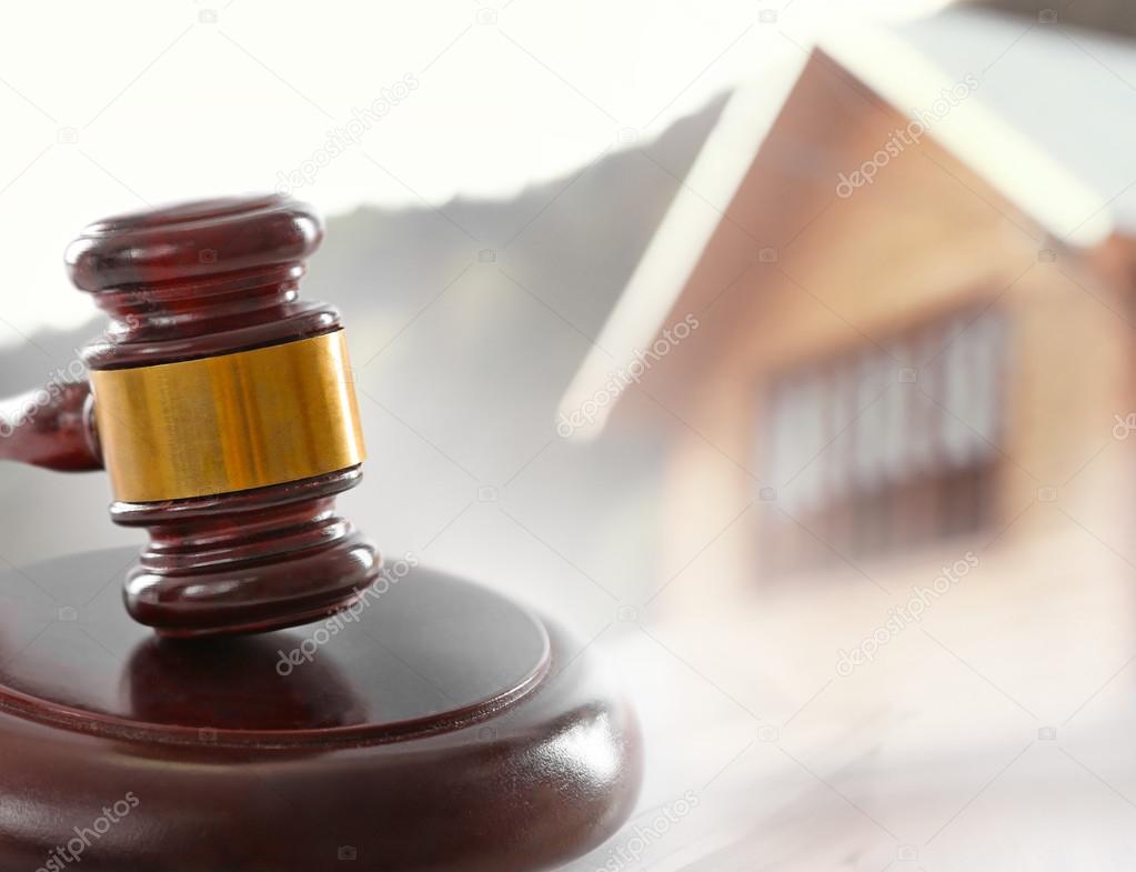 Gavel on blurred house background