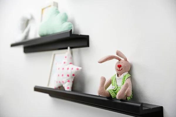 Decorative shelves on wall as detail of kid room interior — Stock Photo, Image