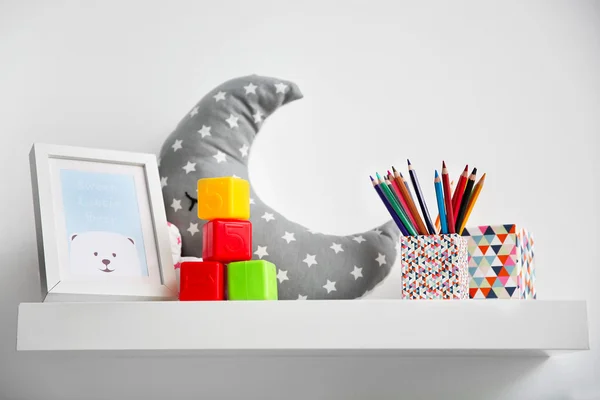 Decorative shelf on wall as detail of kid room interior — Stock Photo, Image