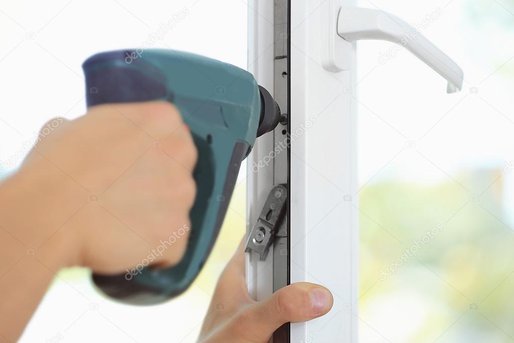 worker installing window