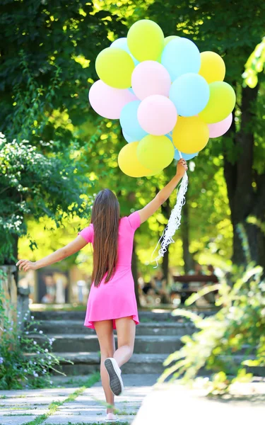 Beautiful girl with balloons — Stock Photo, Image