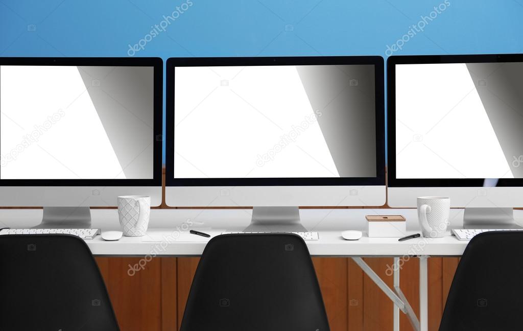 Row of computers in office