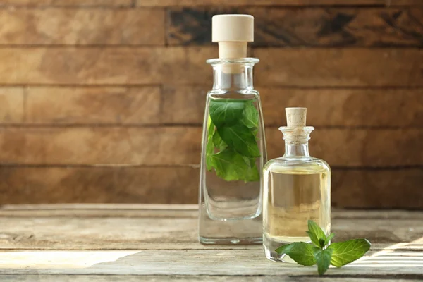 Bottles with mint oil — Stock Photo, Image