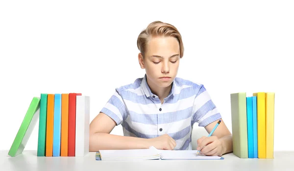 Leuke Jongen Maken Huiswerk Witte Achtergrond — Stockfoto