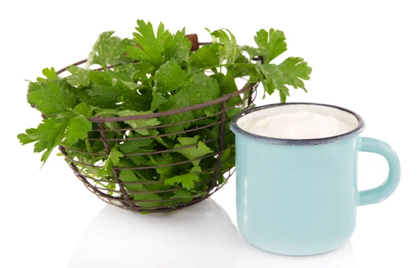 Blue metal mug with cream and parsley in metal basket on white background isolated — Stock Photo, Image