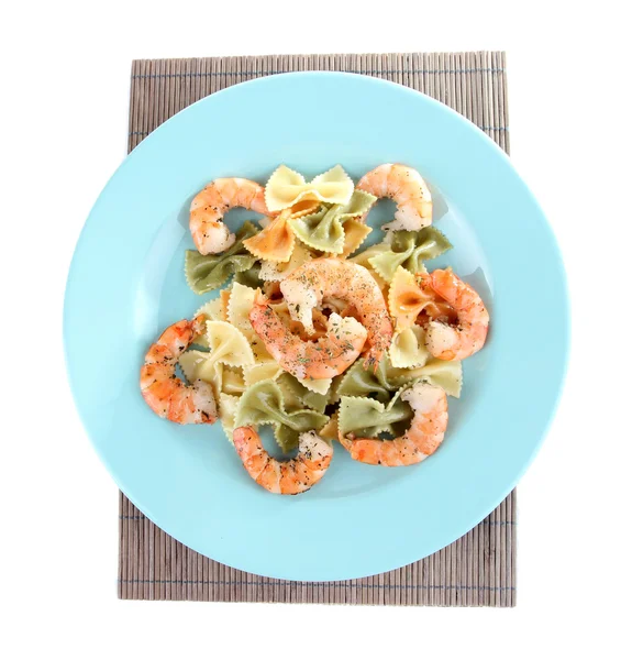 Fresh prawns with coloured macaroni in a big blue plate on a napkin on white background isolated — Stock Photo, Image