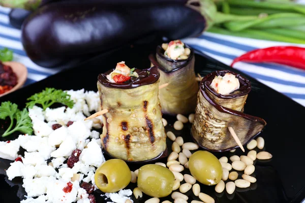 Fried aubergine with cottage cheese  on a square plate on a napkin — Stock Photo, Image