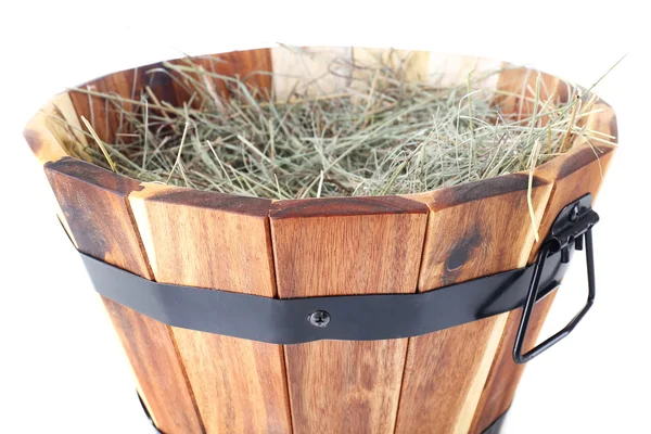 Big wooden basket full of dried grass isolated on white — Stock Photo, Image