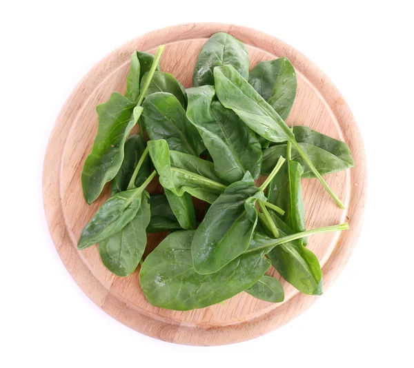 Tuft of fresh sorrel on wooden cutting board isolated on white — Stock Photo, Image