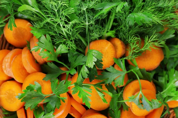 Slices of carrot and parsley closeup — Stock Photo, Image