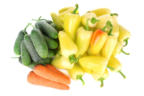 Yellow peppers with cucumbers and carrots isolated on white — Stock Photo, Image