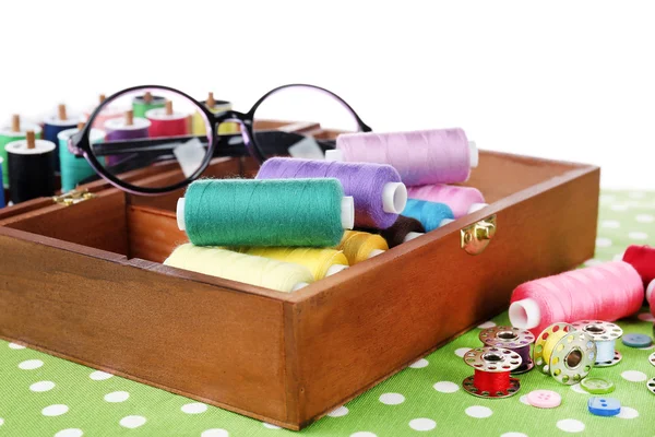 Colorful threads for needlework in wooden box close up — Stock Photo, Image
