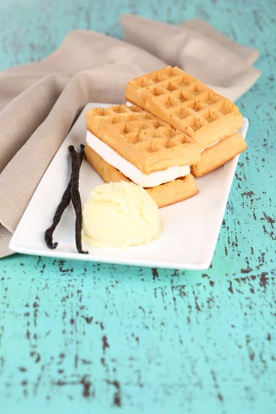 Tasty belgian waffles with ice cream on wooden table — Stock Photo, Image