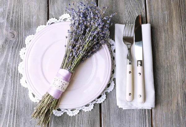 Dining table setting with lavender flowers on wooden table background — Stock Photo, Image