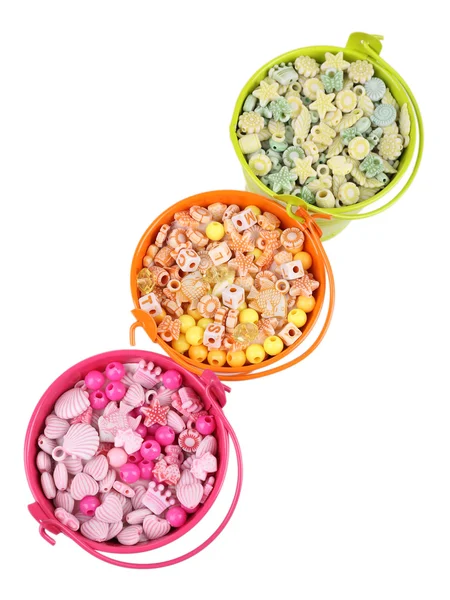 Beads in coloured metal buckets isolated on white — Stock Photo, Image