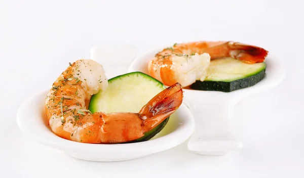 Fresh boiled prawns in a small oval bowl with handle on white background isolated — Stock Photo, Image