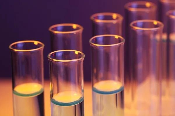 Test tubes with liquid on dark background — Stock Photo, Image