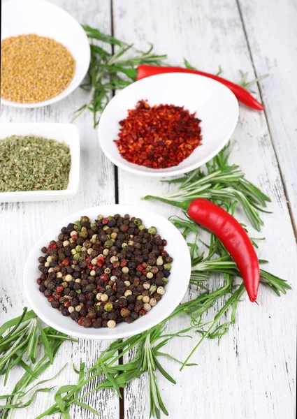 Spice with herbs and dried chilly pepper on wooden background — Stock Photo, Image