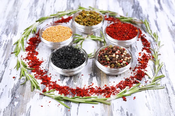 Spices with herbs on wooden background — Stock Photo, Image