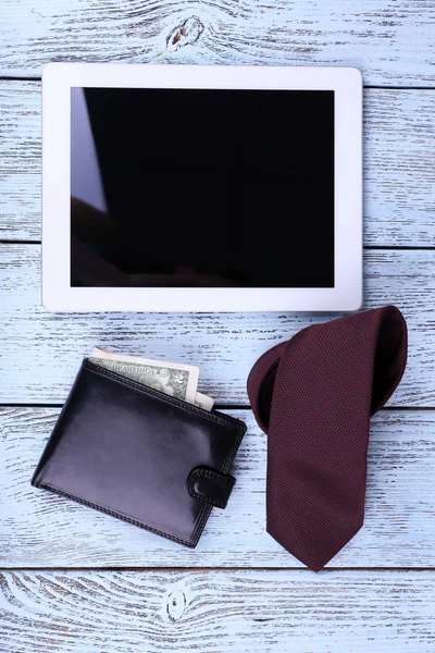 Tablet, wallet and tie on wooden background — Stock Photo, Image