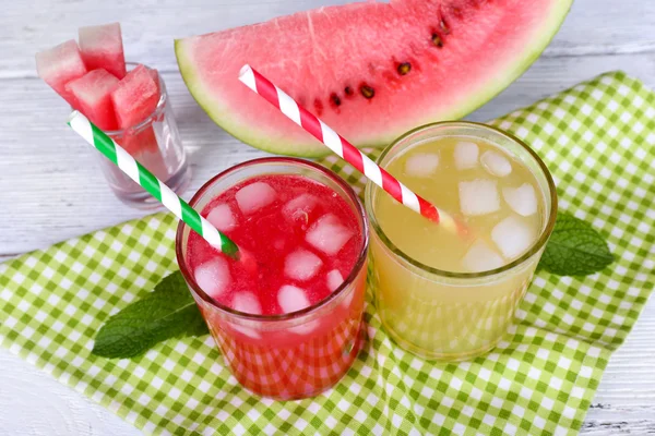 Watermelon cocktail and melon smoothie on wooden table — Stock Photo, Image