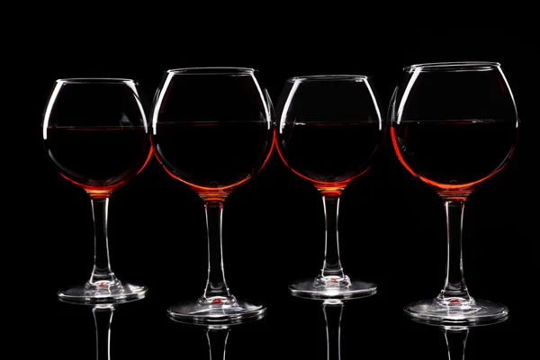 Glasses of wine isolated on black — Stock Photo, Image