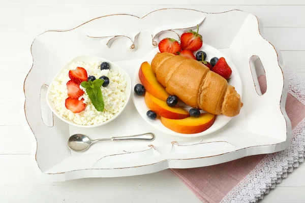 Delicious breakfast with croissant, cottage cheese and fruits — Stock Photo, Image