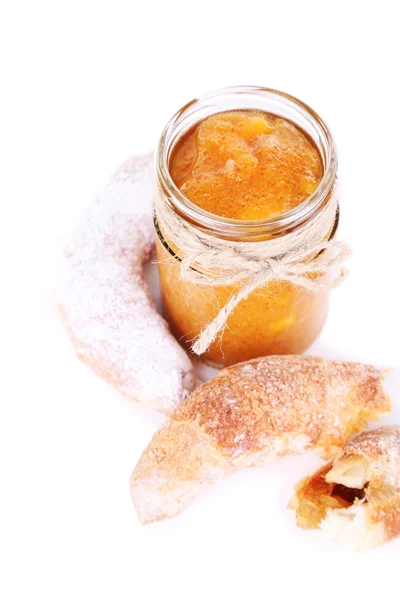 Tasty apricot jam and croissants, isolated on white — Stock Photo, Image