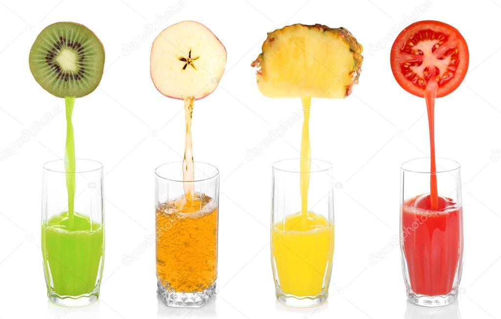 Juice pouring from fruits and vegetables into glass, isolated on white Stock Photo by