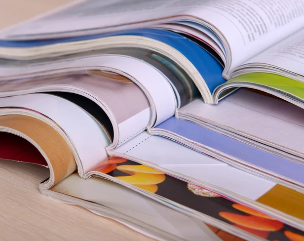 Magazines on wooden table close up — Stock Photo, Image