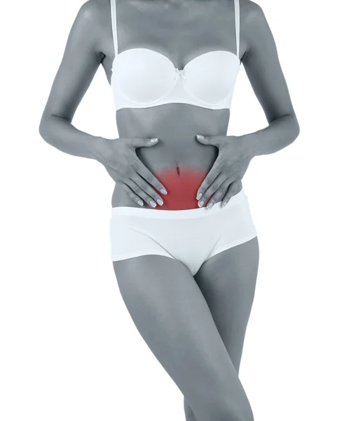 Young woman with abdominal pain isolated on white — Stock Photo, Image