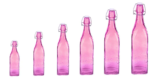 Evolution concept.Colorful bottles isolated on white — Stock Photo, Image