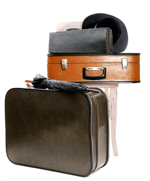 Vintage old travel suitcase and wooden chair with female hat, isolated on white — Stock Photo, Image